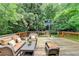 Wooden deck furnished with comfortable outdoor seating and a view of backyard at 799 Monroe Ne Dr, Atlanta, GA 30308