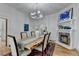 Charming dining room featuring a fireplace, hardwood floors, and a rustic wooden table at 799 Monroe Ne Dr, Atlanta, GA 30308