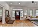 Bright entryway with hardwood floors and a unique stained glass front door at 799 Monroe Ne Dr, Atlanta, GA 30308