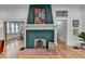Elegant fireplace with a decorative mantle, brick hearth, and hardwood floors at 799 Monroe Ne Dr, Atlanta, GA 30308