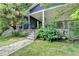 Landscaped front entrance with stone steps, a covered porch, and an attractive exterior at 799 Monroe Ne Dr, Atlanta, GA 30308