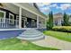 Welcoming front porch with steps, wrought iron railing, and a view of the landscaped yard at 799 Monroe Ne Dr, Atlanta, GA 30308