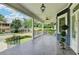 Spacious, covered front porch featuring tiled flooring, a ceiling fan, and an ornate pendant light at 799 Monroe Ne Dr, Atlanta, GA 30308