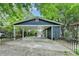 Detached garage with a carport and iron gate provides covered parking and easy access at 799 Monroe Ne Dr, Atlanta, GA 30308