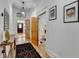 Hallway with wood floors, paneled doors, and decorative rug at 799 Monroe Ne Dr, Atlanta, GA 30308