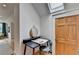 A hallway alcove features a small desk, chair, mirror, door, and a skylight, creating a cozy and functional space at 799 Monroe Ne Dr, Atlanta, GA 30308
