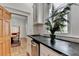 Open kitchen area featuring dark countertops, stainless steel appliances, and access to dining room at 799 Monroe Ne Dr, Atlanta, GA 30308
