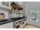 Gourmet kitchen has stainless steel appliances, white subway tile backsplash, and black stone countertops at 799 Monroe Ne Dr, Atlanta, GA 30308