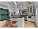 Spacious kitchen features an island with bar seating, stainless steel appliances, and hardwood floors at 799 Monroe Ne Dr, Atlanta, GA 30308