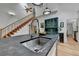 The kitchen island features a sink with a stainless steel faucet and black stone countertops at 799 Monroe Ne Dr, Atlanta, GA 30308