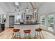 Bright kitchen features an island with bar seating, stainless steel appliances, and hardwood floors at 799 Monroe Ne Dr, Atlanta, GA 30308