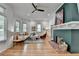 Bright living room featuring hardwood floors, a decorative fireplace, and a comfortable seating area at 799 Monroe Ne Dr, Atlanta, GA 30308