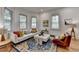 Comfortable living room with natural light, a plush sofa, and hardwood flooring at 799 Monroe Ne Dr, Atlanta, GA 30308