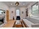 Cozy living room with a brick fireplace and hardwood floors at 799 Monroe Ne Dr, Atlanta, GA 30308