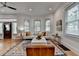 Well-lit living room with hardwood floors, large windows, and modern decor at 799 Monroe Ne Dr, Atlanta, GA 30308