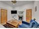 Inviting living room featuring a brick fireplace, built-in shelving, and cozy furniture at 799 Monroe Ne Dr, Atlanta, GA 30308