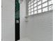 Shower with glass door, glass block window, and elegant tiling at 799 Monroe Ne Dr, Atlanta, GA 30308