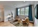 Sitting area featuring two chairs, a window with curtains, and a rug at 799 Monroe Ne Dr, Atlanta, GA 30308