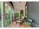 Sunroom featuring tile floors, screen windows, and peaceful outdoor view at 799 Monroe Ne Dr, Atlanta, GA 30308