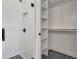 Modern bathroom features a glass shower and ample shelving at 150 Rolison Way, Fayetteville, GA 30214