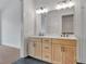 Modern bathroom features a double vanity with white countertop and dark fixtures at 150 Rolison Way, Fayetteville, GA 30214
