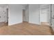 Open bedroom layout with wood flooring and doorways leading to a bathroom and closet at 150 Rolison Way, Fayetteville, GA 30214