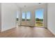 Bright, open bedroom with wood floors and double doors leading to an outdoor view at 150 Rolison Way, Fayetteville, GA 30214