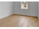 Simple bedroom with white walls and trim, light wood flooring and a window providing natural light at 150 Rolison Way, Fayetteville, GA 30214