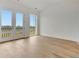 Bright, open bedroom with wood floors and double doors leading to an outdoor view at 150 Rolison Way, Fayetteville, GA 30214