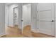 Hallway with open doors leading to additional rooms in the house at 150 Rolison Way, Fayetteville, GA 30214