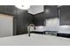 Close up of eat-in kitchen featuring stainless steel appliances and quartz countertops at 150 Rolison Way, Fayetteville, GA 30214