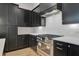 Contemporary kitchen showcases a stainless steel range and oven against white subway tile backsplash at 150 Rolison Way, Fayetteville, GA 30214