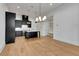 Eat-in kitchen featuring a large island, stainless steel appliances, and modern pendant lighting at 150 Rolison Way, Fayetteville, GA 30214