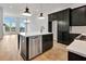 Modern eat-in kitchen with stainless steel appliances, a central island, and lots of natural light at 150 Rolison Way, Fayetteville, GA 30214