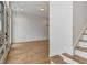 Bright living room featuring hardwood floors, white walls and a glass french door with sidelights at 150 Rolison Way, Fayetteville, GA 30214
