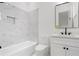 Modern bathroom featuring marble-style tile, a built-in niche, black hardware, and a stylish vanity at 1525 Tapestry Rdg, Lawrenceville, GA 30045