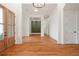 Elegant foyer with hardwood floors and a view to the rear of the home at 1525 Tapestry Rdg, Lawrenceville, GA 30045