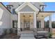Charming front porch with stone accents and a welcoming entrance at 1525 Tapestry Rdg, Lawrenceville, GA 30045
