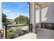 Beautiful front porch with brick floor and black metal railing at 1525 Tapestry Rdg, Lawrenceville, GA 30045