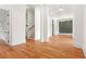 Elegant living room with hardwood floors, modern trim, and green accent wall at 1525 Tapestry Rdg, Lawrenceville, GA 30045