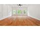 Spacious living room filled with natural light and featuring hardwood floors at 1525 Tapestry Rdg, Lawrenceville, GA 30045