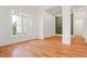 Bright room with hardwood floors and a large window at 1525 Tapestry Rdg, Lawrenceville, GA 30045