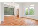 Elegant Living room with hardwood floors and custom wall paneling at 1525 Tapestry Rdg, Lawrenceville, GA 30045