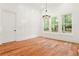 A bright room featuring hardwood floors and backyard views at 1525 Tapestry Rdg, Lawrenceville, GA 30045