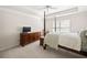 Bedroom with a four-poster bed and dresser, offering a comfortable and stylish living space at 10540 Waters Ridge Dr, Alpharetta, GA 30022