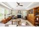 Bright living room with a fireplace, large windows, and comfortable seating, perfect for Gathering gatherings at 10540 Waters Ridge Dr, Alpharetta, GA 30022