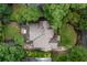 This is an aerial view of a house with a hot tub and green spaces, surrounded by trees, in a neighborhood at 164 Ridley Cir, Decatur, GA 30030
