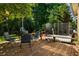 Spacious backyard deck featuring a hot tub, trampoline, and charming outdoor seating area surrounded by lush greenery at 164 Ridley Cir, Decatur, GA 30030