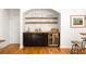 Elegant home bar with built-in wine storage, wooden countertop, and a decorative backsplash at 164 Ridley Cir, Decatur, GA 30030