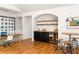 Home bar with dark cabinets, a wine refrigerator, sink, and barstool seating at 164 Ridley Cir, Decatur, GA 30030